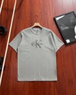 Calvin Klein Embossed Letter Logo Crew Neck Loose Cotton Short Sleeve T-shirt 4 Colors - Image 3