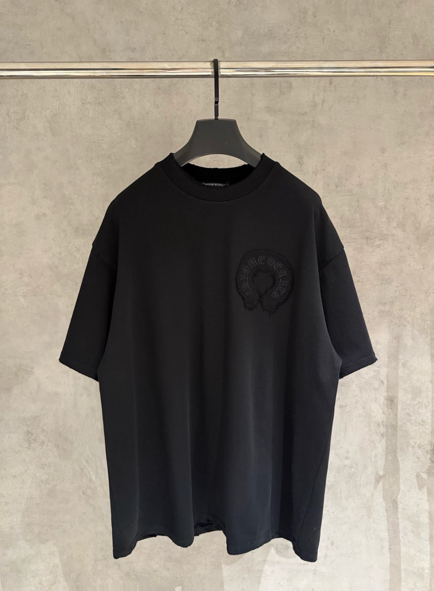 26070914-Chrome-Heart-Tee-01 Chrome Hearts Black Oversized Short‑Sleeve T‑Shirt Distressed Raw‑Edge Tone‑In‑Circle Embroidery Tee - Image 1