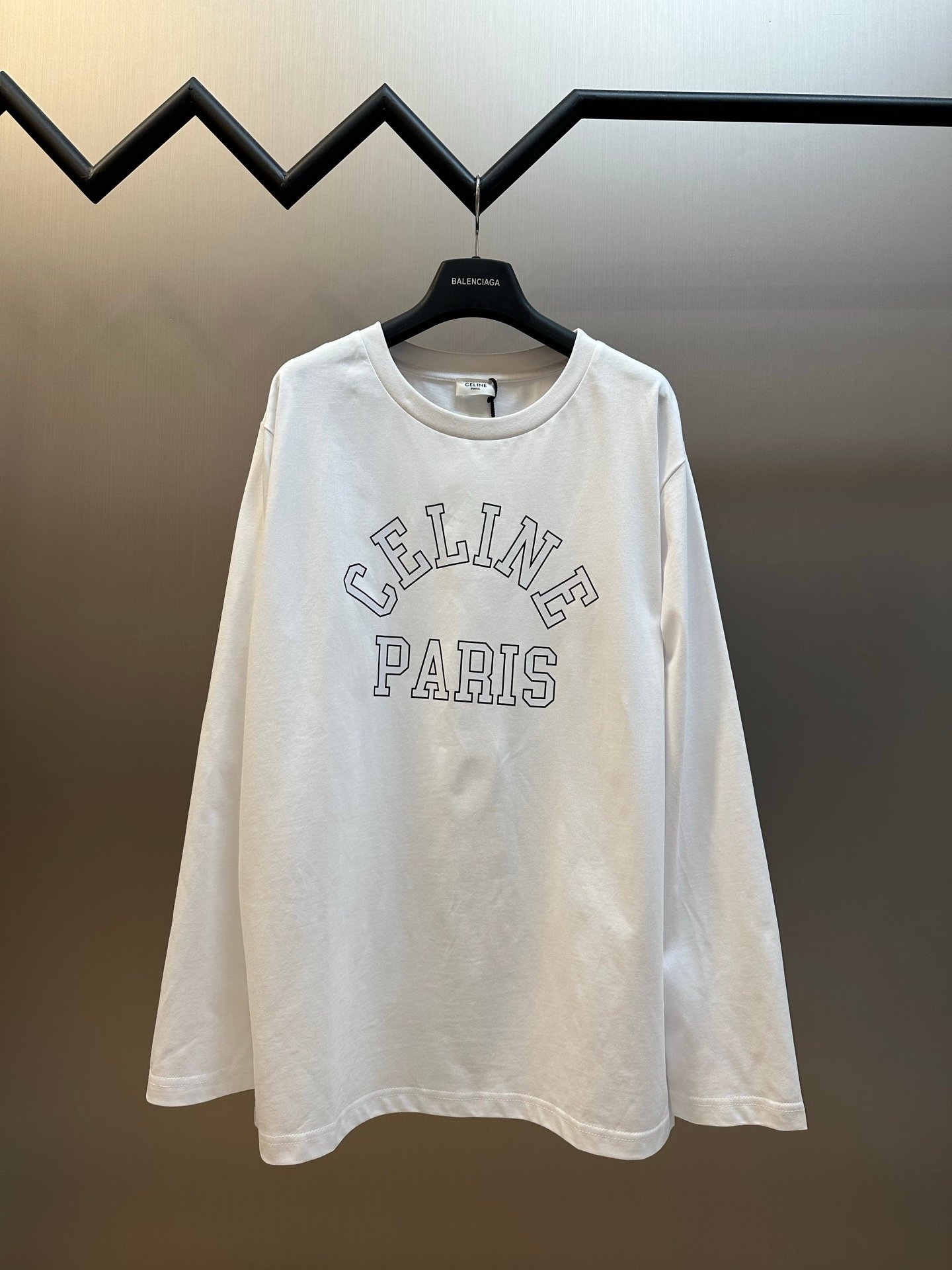26071418-Celine-Hoody-White-01 Celine White Oversized Long‑Sleeve T‑Shirt Arch Hollow‑Font Letter Print Casual Loose‑Fit Top - Image 1