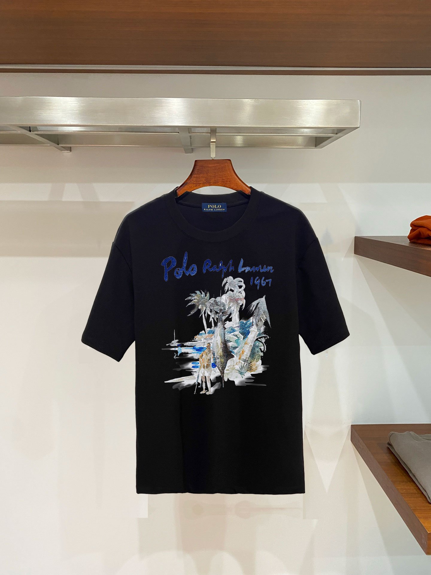 26081217-Ralph-Lauren-Tee-17 Polo Ralph Lauren Men's Tropical Island Landscape Print Crew‑Neck T‑Shirt 1967 Cotton Vacation In Black - Image 1