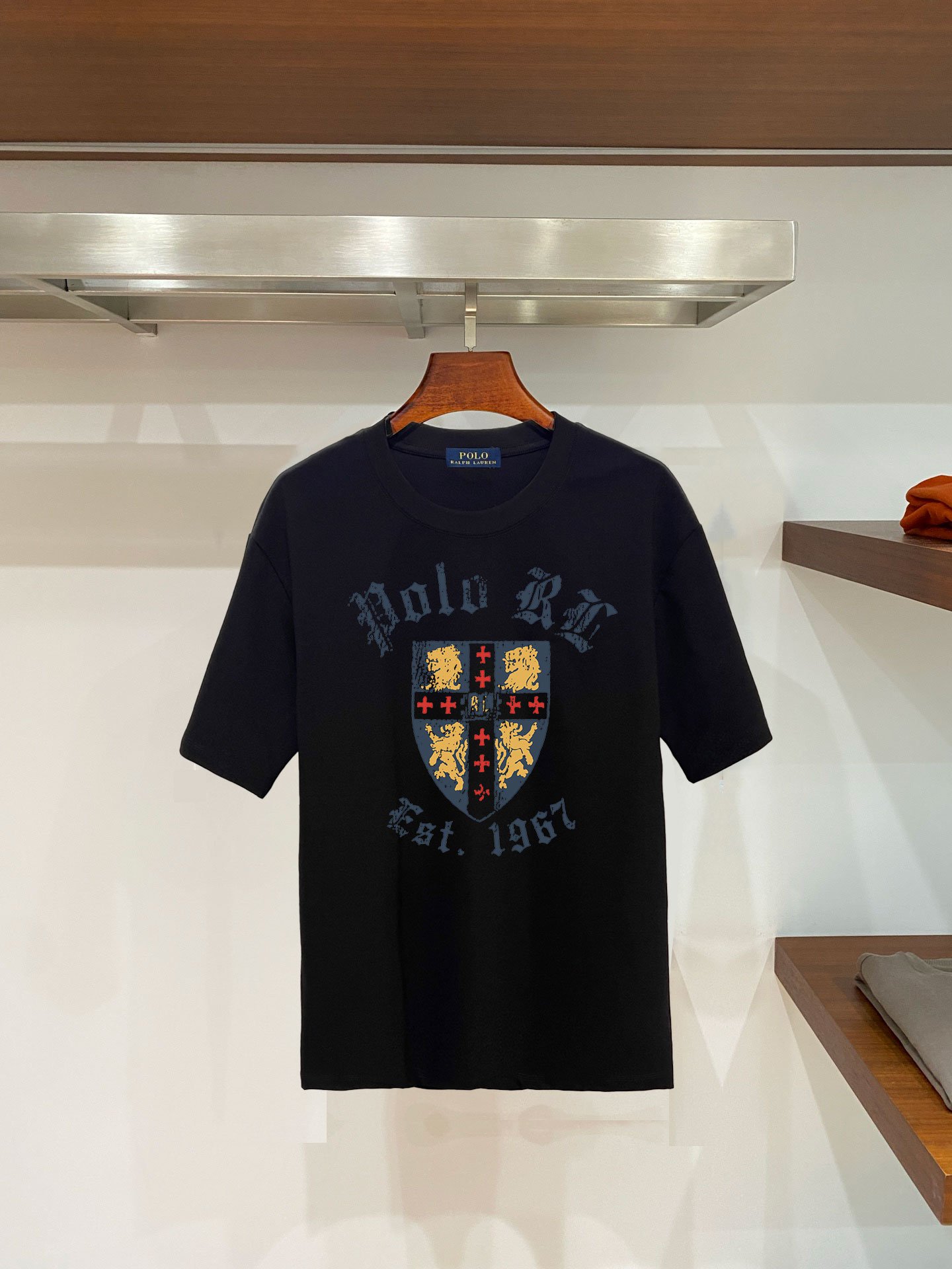 26081217-Ralph-Lauren-Tee-49 Polo Ralph Lauren Men Vintage Shield Lion Graphic T‑Shirt Polo RL Est.1967 In Black - Image 1