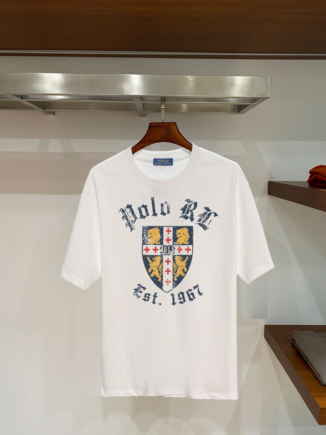 26081217-Ralph-Lauren-Tee-53 Polo Ralph Lauren Men Vintage Shield Lion Graphic T‑Shirt Polo RL Est.1967 In White - Image 1