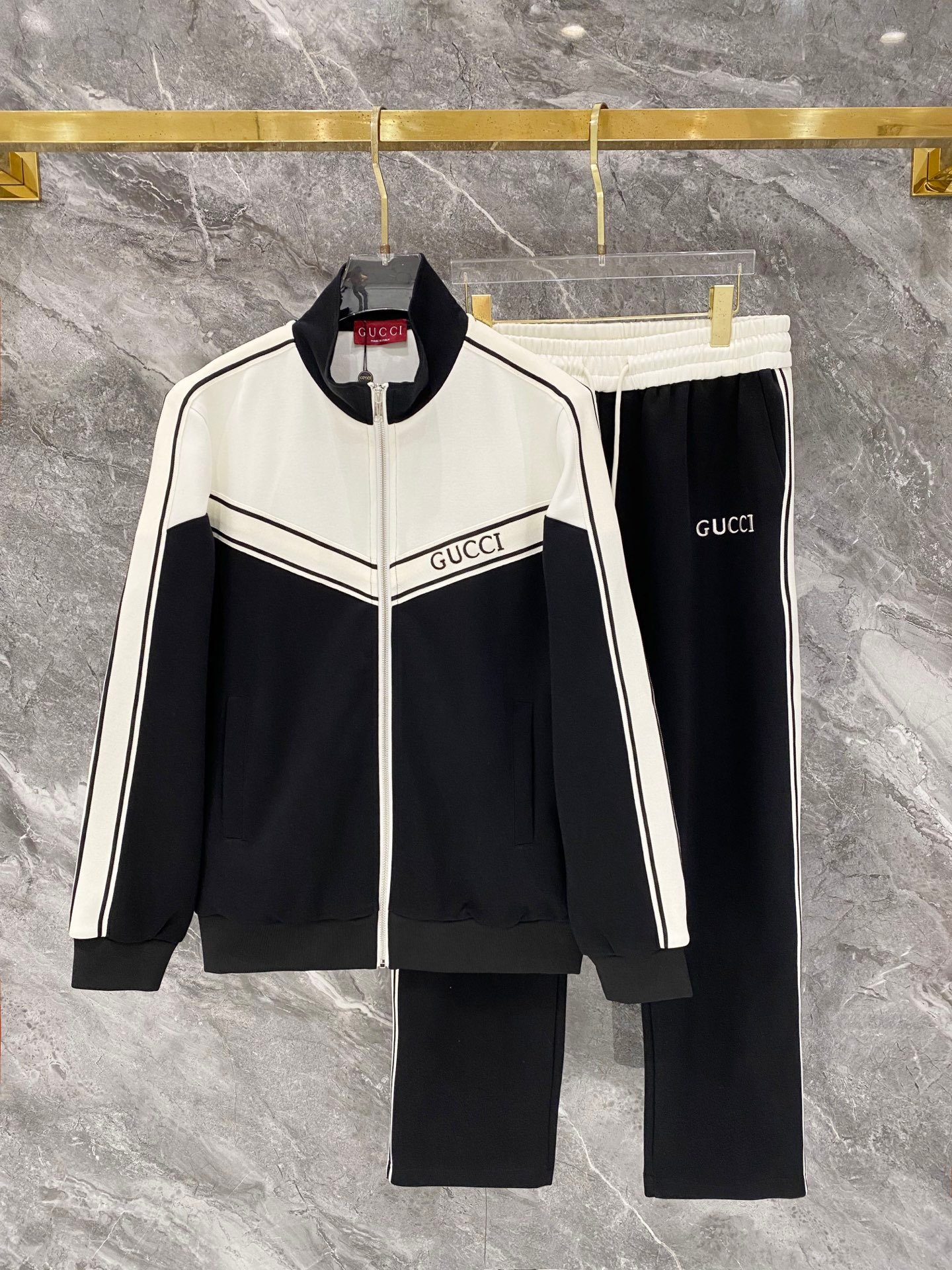 26081801-Gucci-Outfit-260-123 Gucci Men Knit Tracksuit Set Color‑Block Stand Collar Zip‑Up Jacket Straight‑Leg Sweatpants 2pcs Black Outfit - Image 1
