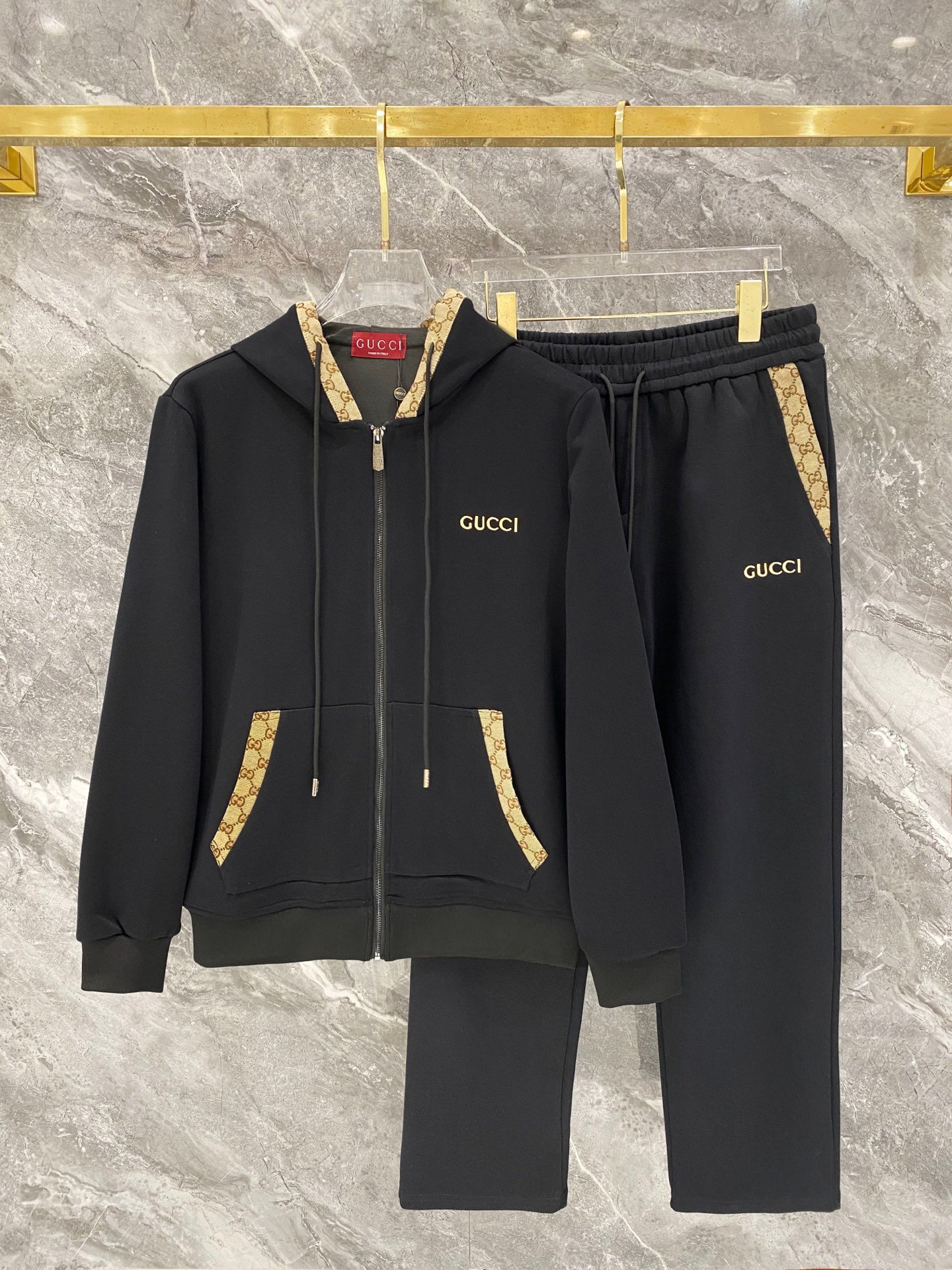 26081801-Gucci-Outfit-260-161 Gucci Men Knit Tracksuit Set Monogram Trim Hooded Zip‑Up Jacket Straight‑Leg Sweatpants 2pcs Black Outfit - Image 1