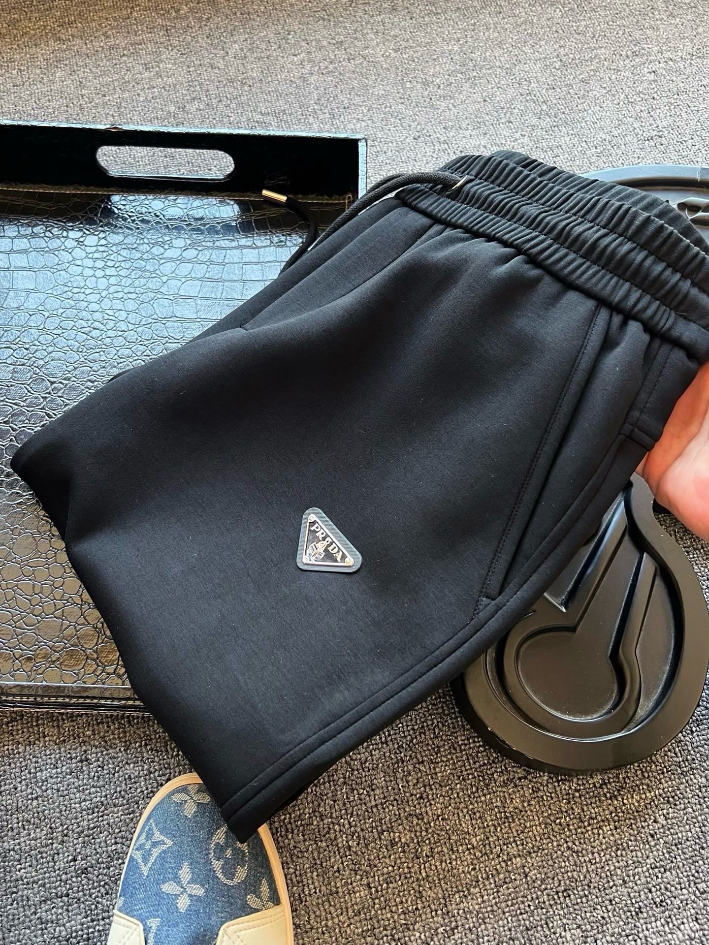 26090401-Prada-046 Prada Triangle‑Logo Drawstring Jogger Pants Elastic Waist Tapered Sweatpants - Image 1